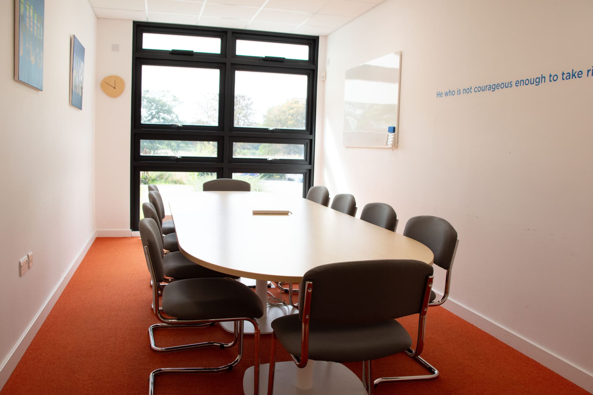 Image of large meeting table and chairs